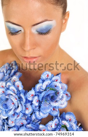Gorgeous woman with blue flower dress over white background