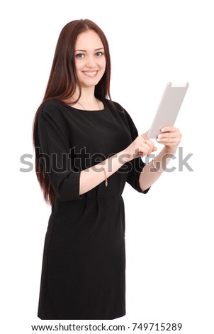 Happy student teenage girl keeps tablet pc standing sideways isolated on white