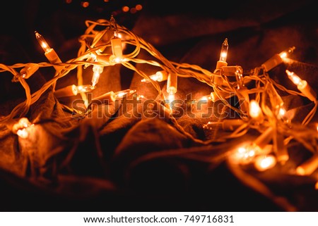 Christmas lights on dark gray background with copy space