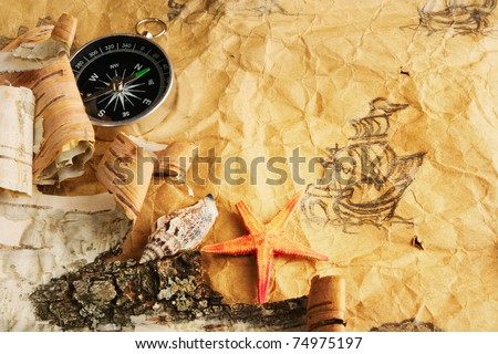 Still-life. Antique map, shell, starfish and compass
