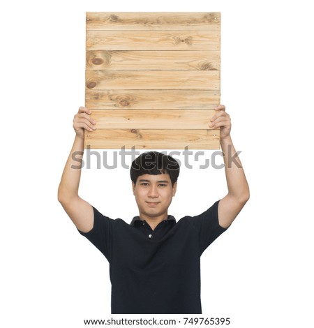 Asian handsome man holding wooden board on white background with clipping path.
Advertisement board. Product presentation.