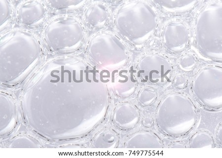 transparent bubbles on grey abstract background Royalty-Free Stock Photo #749775544