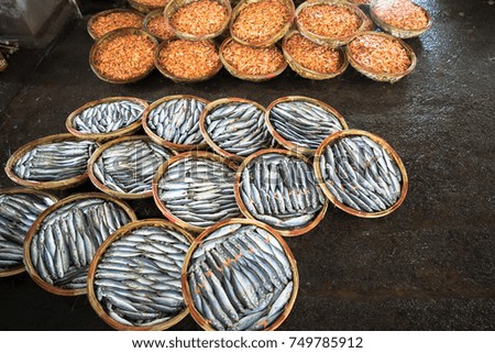 Boiled fish and shrimp basket. Seafood processing at fish market in Quy Nhon, south Vietnam