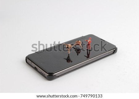  the figure of Sumo Wrestler with mobile phoe