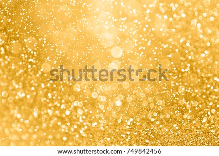 Elegant gold glitter sparkle confetti background for golden happy birthday party invite, 50th wedding anniversary, glitz and glam, glitzy coins, Christmas ad or New Year’s Eve champagne color backdrop Royalty-Free Stock Photo #749842456