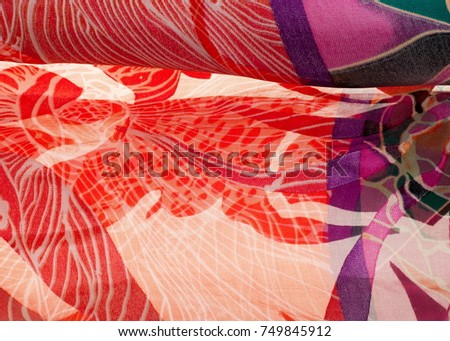 Fabric silk texture. abstract painting. bstract wave pattern on silk batik. a fine, strong, soft, lustrous fiber produced by silkworms in making cocoons and collected to make thread 