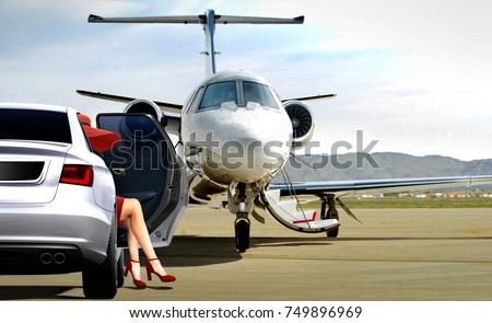 Women getting ready to boarding private jet at airfield Royalty-Free Stock Photo #749896969