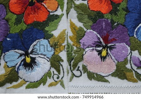 embroidered flowers on white fabric