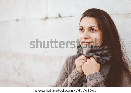 Pretty woman wearing warm scarf