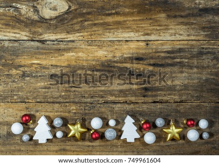 Christmas background with traditional christmas elements on rustic wood