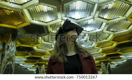 Virtual reality, 3D-technologies, cyberspace, science and people concept - happy young woman in 3d glasses. Young woman in a VR glasses on abstract background