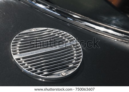 Air intake grille. Luxury vintage car fragment, close up photo with selective soft focus