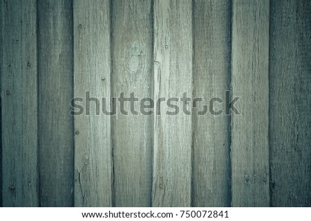 Old wooden planks with peeling paint like background. Toned.