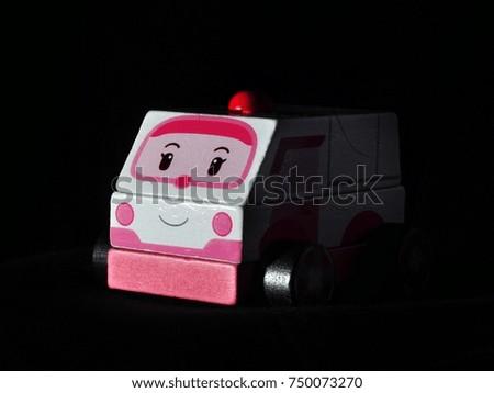 A Wooden Block of Pink Baby Toy Car
