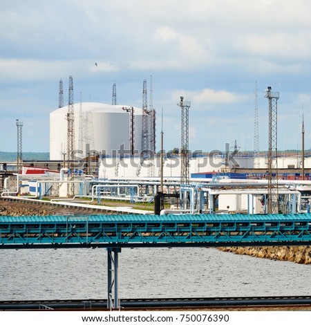 Oil storage tanks at Ventspils terminal on a clear summer day, Latvia