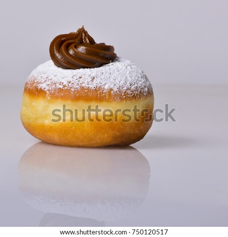 jewish food holiday Hanukkah symbol image of donut with jelly and sugar powder. isolated .