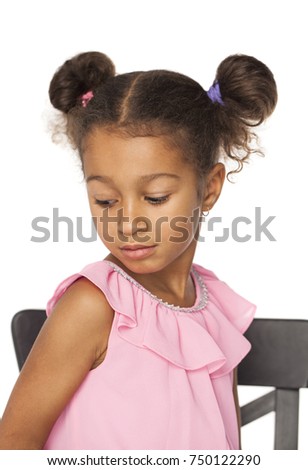 Close up portrait of little african girl with afro hairstyle isolated on white background