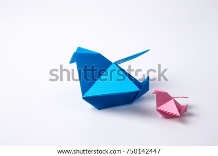 Origami bird isolated on a white background.