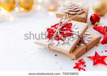 Christmas and New Year background with presents and decorations for Christmas tree. Holiday background with stars confetti and light bulbs. Place for text.