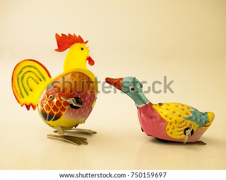 Duck and chicken tin toy / Isolated white