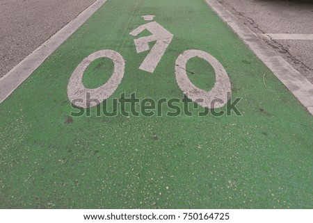 Bike Lane Road Sign On Pavement
