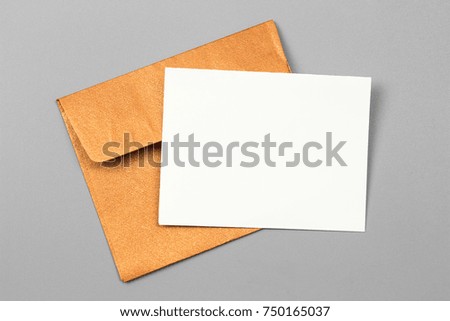 Mockup paper. blank white paper card with Envelope card on gray background.