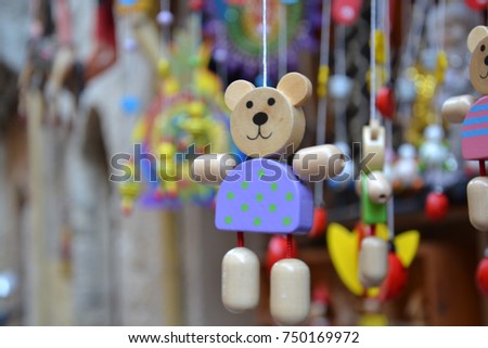 Wood bear toy hanging by a rope - Picture from Greece.