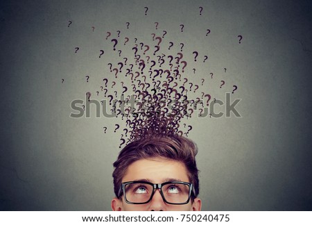 Man with too many questions and no answer   Royalty-Free Stock Photo #750240475