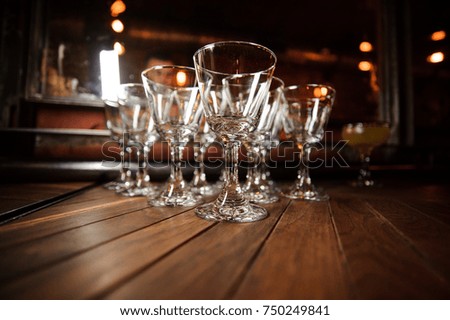 Close up photo of the set of washed and clean empty cocktail glasses on the floor. Cocktail glass concept