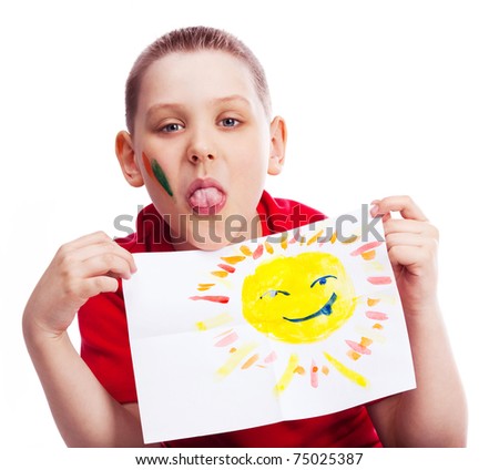 ten year old boy showing his tongue and holding a watercolor picture of the sun