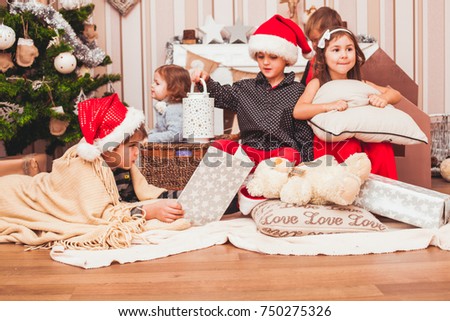 Two boys wearing Santa caps