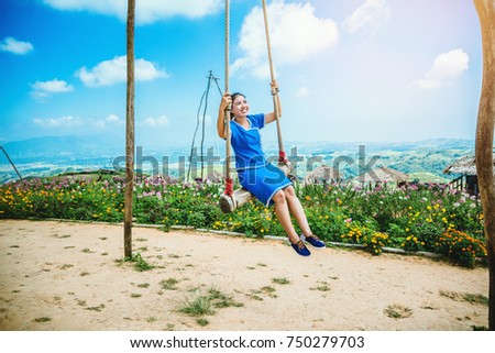 Asian women travel sleep relax.Women wear dresses. Living Swing. Thailand