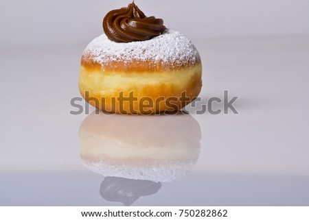 jewish food holiday Hanukkah symbol image of donut with chocolate. isolated .