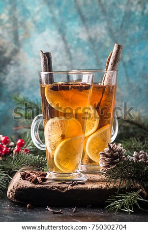 Christmas or Thanksgiving drink. Autumn and winter cocktail - grog, hot sangria, mulled wine with tea, lemon, rome, cinnamon, anise and other spices.