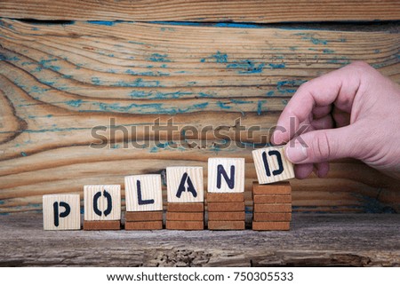 Poland. Wooden letters on the office desk, informative and communication background