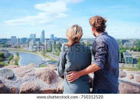 Young Dutch couple looking at panorama with city skyline concept