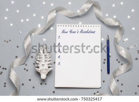 Notebook with pen and christmas decoration, balls, snowflakes. Copy space. Space for your text. Close up, top view