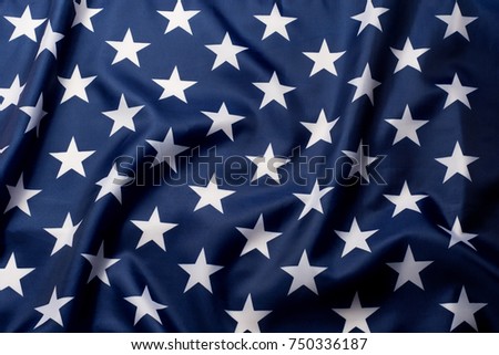 Beautifully waving stars of American flag close up background.