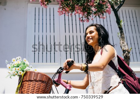 Pretty georgian woman  with bicycle,travel bike summer concept