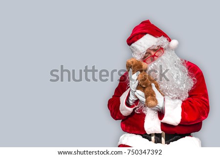 Santa claus have a teddy for children,merry christmas,Gifts for Children,Portrait of santa claus on white background,December is the month of Christmas.