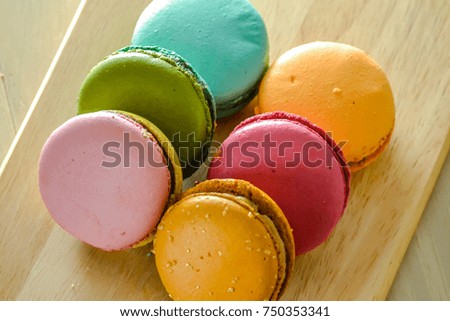 Homemade delicious macaroni cookies of different colors close-up