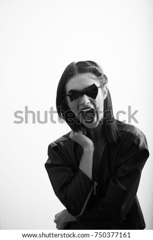 Wonderful woman in black suit screaming on white background