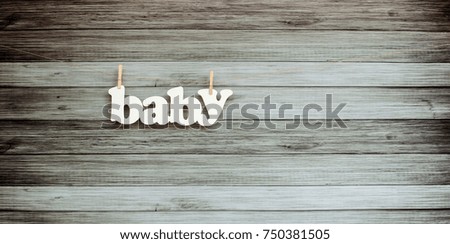 Wooden background with inscription baby
