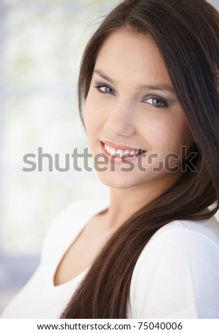 Portrait of beautiful young girl smiling happily.?