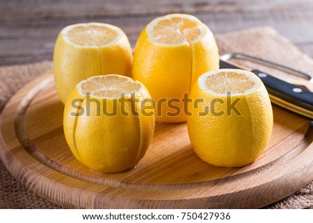 Whole lemons on cutting board