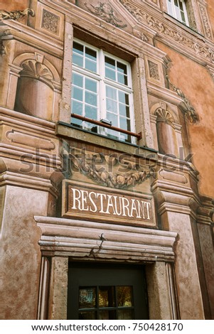 Beautiful Luxury Restaurant signage on the vintage painted building in Colmar, France