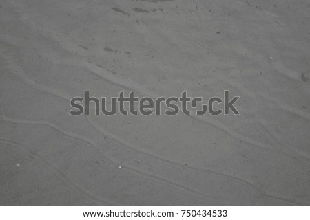 Water and sand, on the shore of the Baltic Sea in Tallinn
