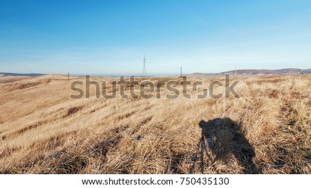 Photographer shadow on fields