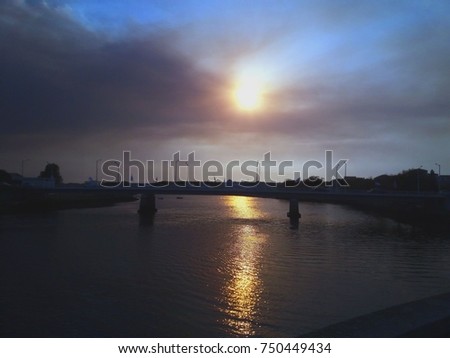 Spectacular sunset with reflection in the river