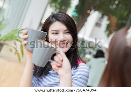 woman friends smile happily in the restaurant